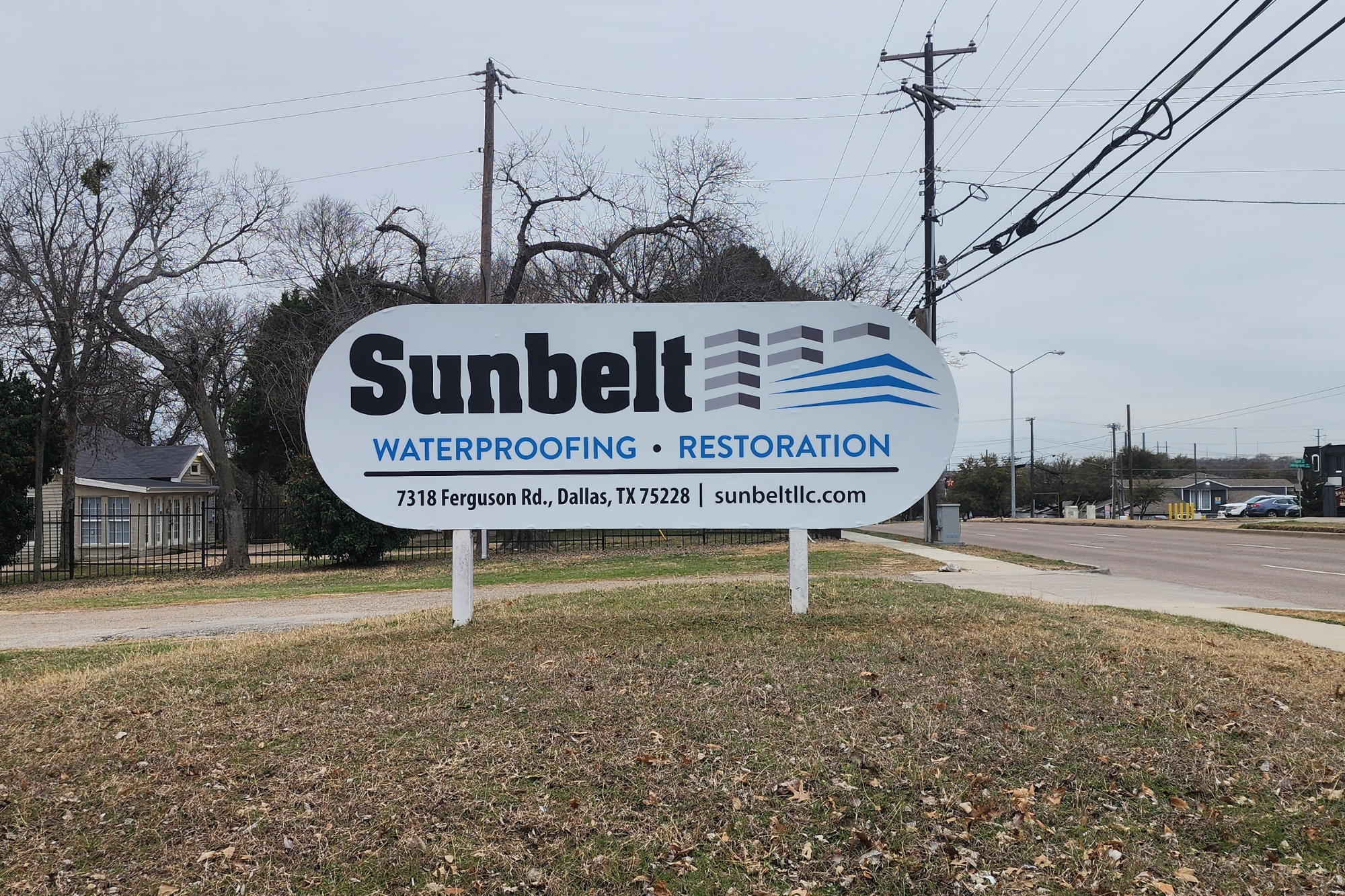 Architectural Sign in Dallas, TX by It's A Good Sign for a waterproofing and restoration company installed in their yard beside the street